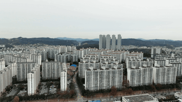 Aerial view of city with high-rise apartment complexes
