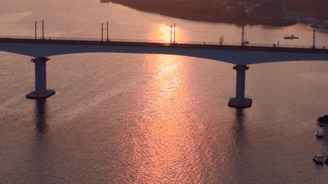 Sunset over a bridge and river