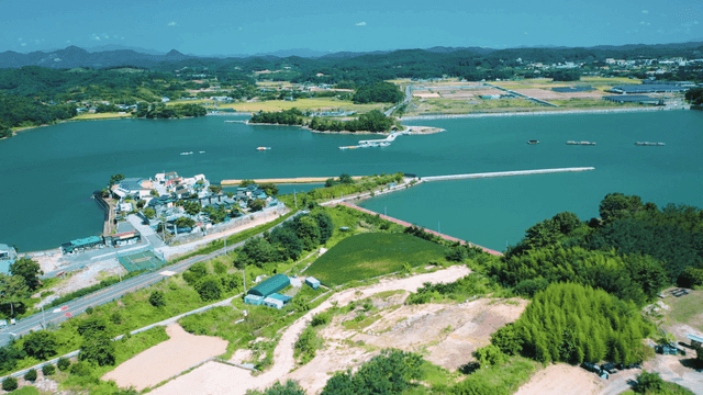A scenic coastal village with lush greenery