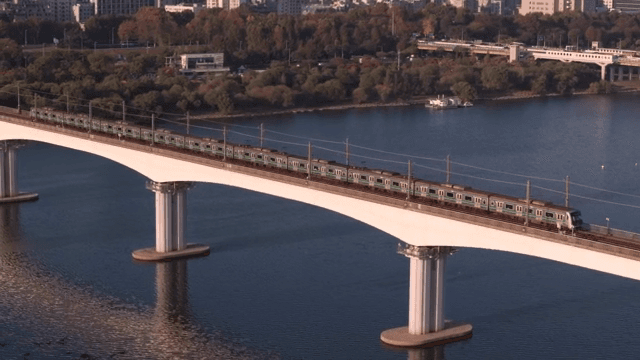 Train crossing a bridge over a river