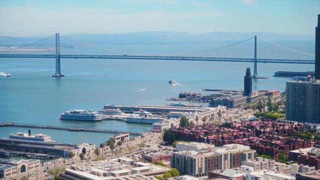 Scenic Waterfront Cityscape With Bridge