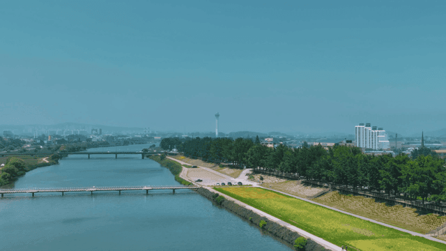River cutting through city landscape.