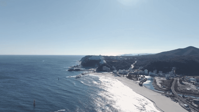 Coastal town with beaches and mountains