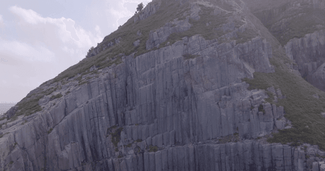 Majestic rocky cliff under a clear sky