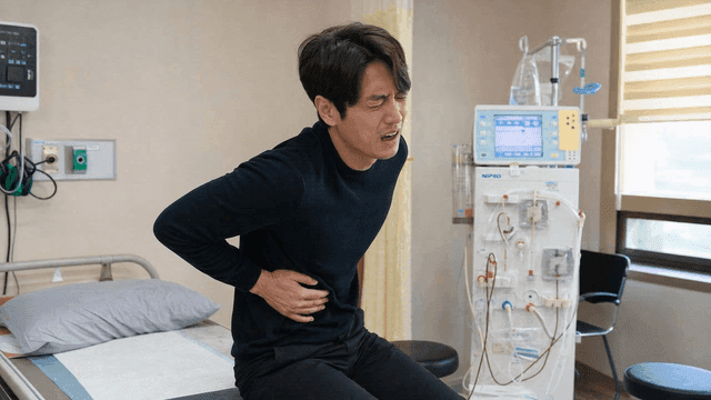 Man in pain in hospital room
