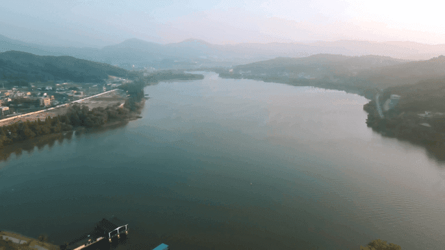 Tranquil lake surrounded by hills