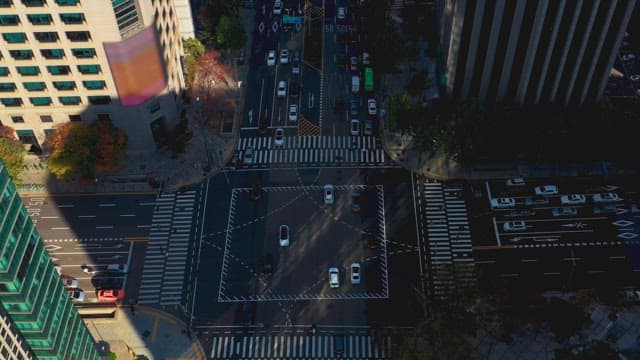 Busy city intersection with moving cars