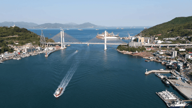 Bustling port city with a bridge