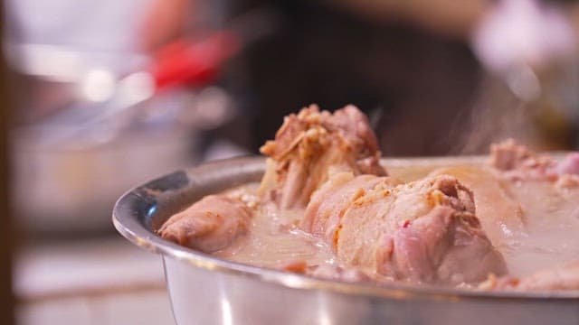 Pig's feet boiling in a pot