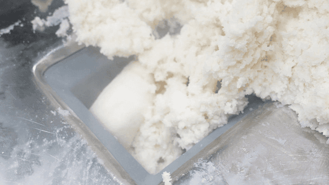 White rice cake dough processed by machine