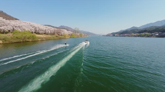 Person wakeboarding on a scenic river