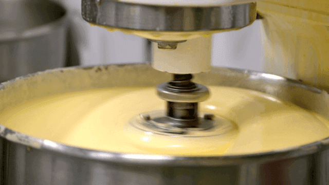 Mixing batter in a large industrial mixer