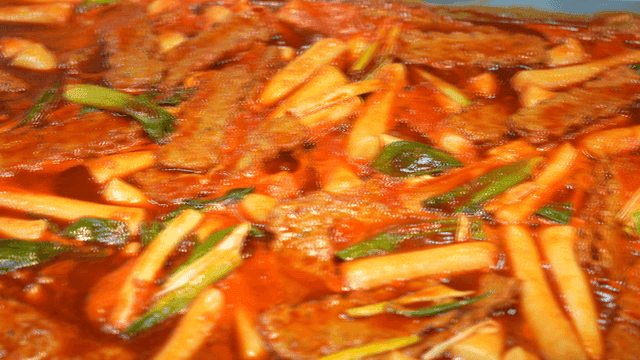 Spicy tteokbokki simmering in a pan