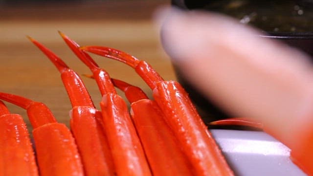 Close-up of fresh red crab legs on a plate