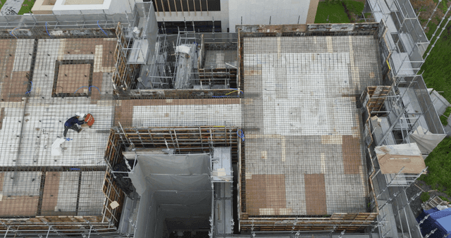 Construction site with workers on a building