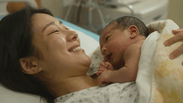 Mother holding a newborn baby in the hospital