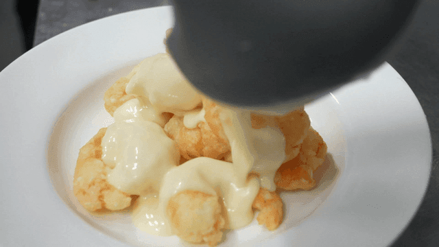 Fried shrimp with cream sauce poured over it
