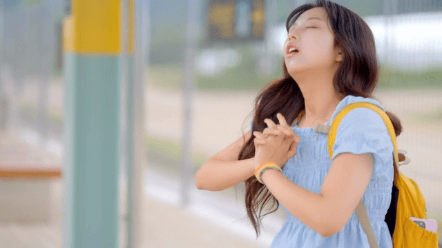 A young woman stretching at a station