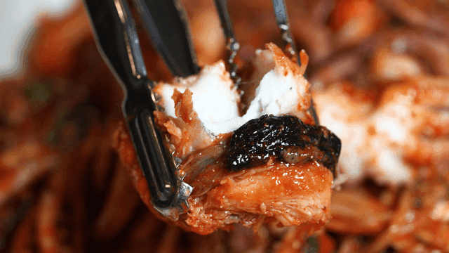 Spicy monkfish seafood stew to tear apart with tongs