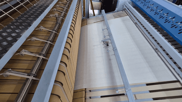 Large fabric ironing machine in laundry factory