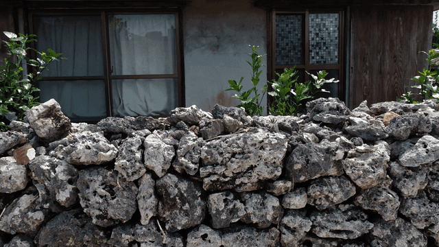 Traditional stone wall country village road
