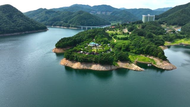 Camping Site Surrounded by a Quiet Lake and Greenery