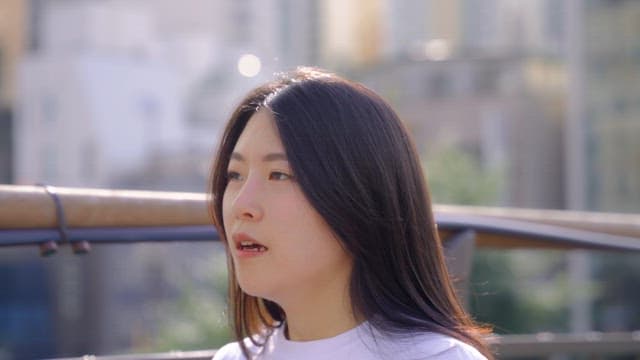 Woman walking on a bridge outdoors