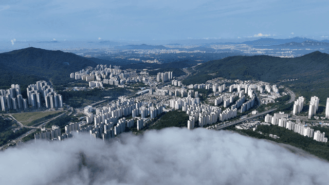 Vast city landscape surrounded by mountains