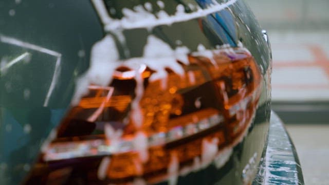 Foam on Talllights of a Car Being Washed