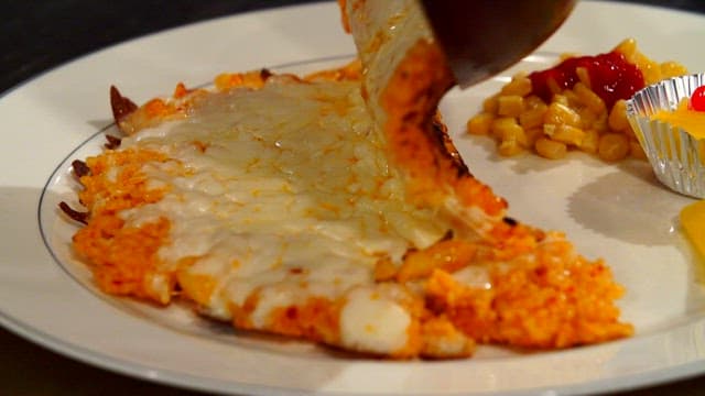 Cheese-filled kimchi fried rice on a plate