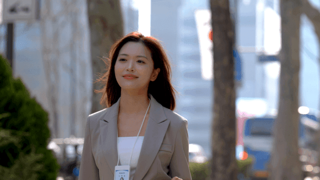 Working woman walking confidently on city street