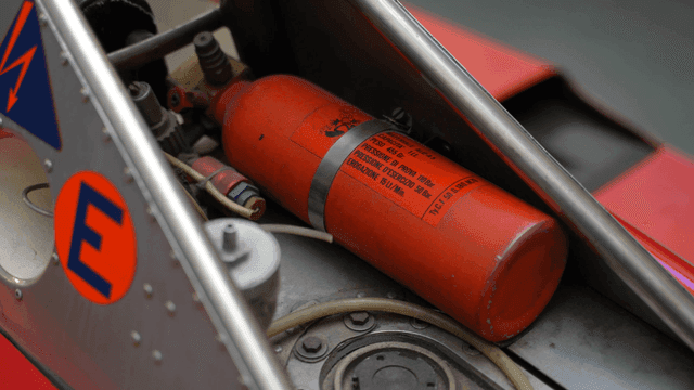 Close-up of a fire extinguisher in a vehicle
