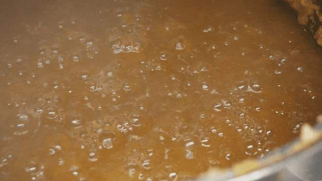 Brown sauce simmering in a pot