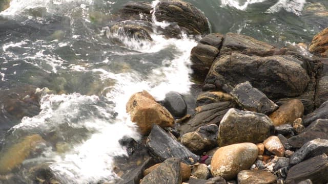 Waves crashing on rocky shore