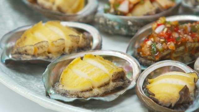 Appetizing butter-grilled abalone with spicy sauce