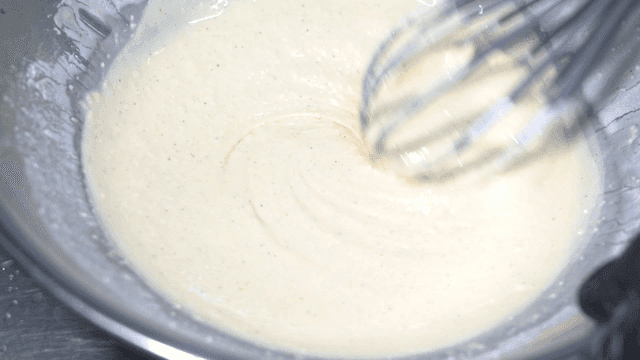 Whisk for mixing dough in metal bowl