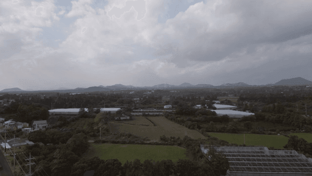 Expansive rural landscape with distant hills