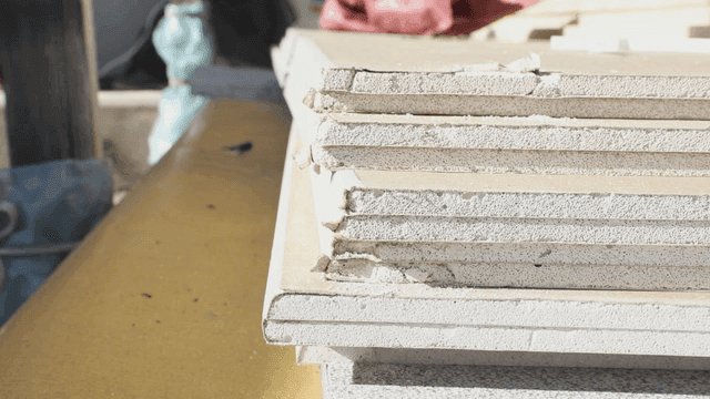 Stack of construction boards in sunlight