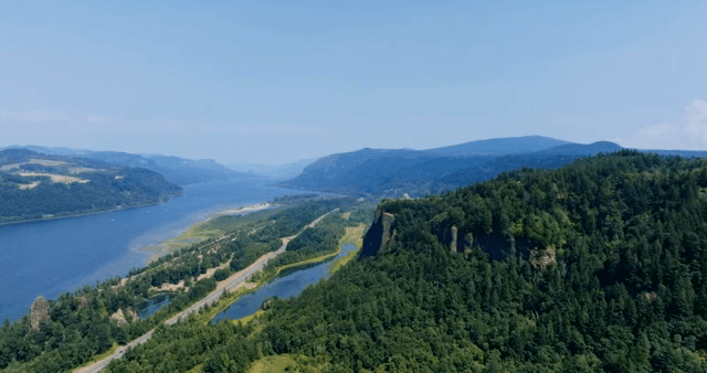 A scenic river flowing through lush mountains