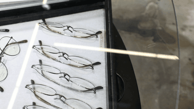 Cleaning glasses from a display case