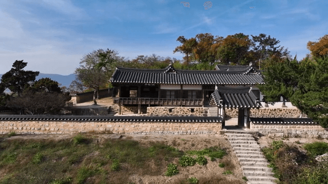 Traditional Korean house with autumn trees