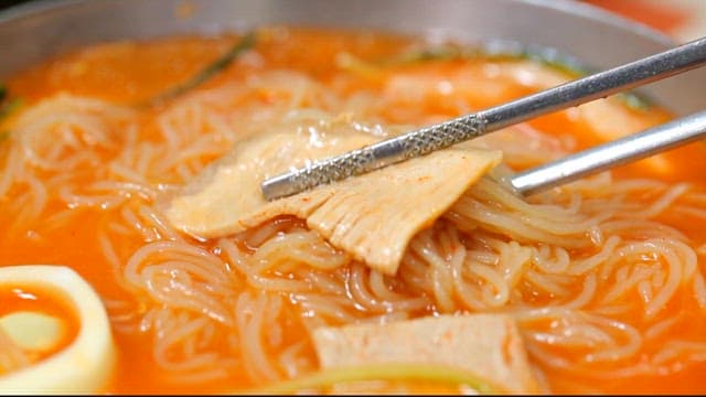 Wheat noodles with sirloin picked up with chopsticks