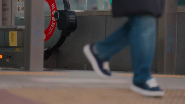 People walking past a subway entrance