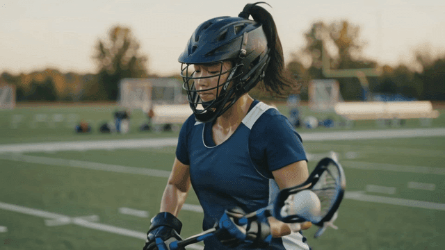 Lacrosse player on field.