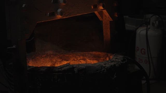 Molten metal being taken out of the foundry