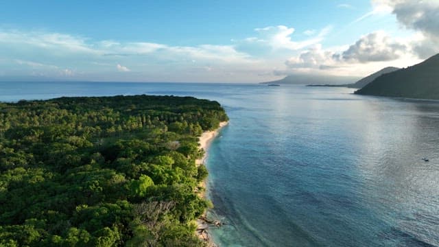 Vast sea with views of the island's green forests and tranquil beaches