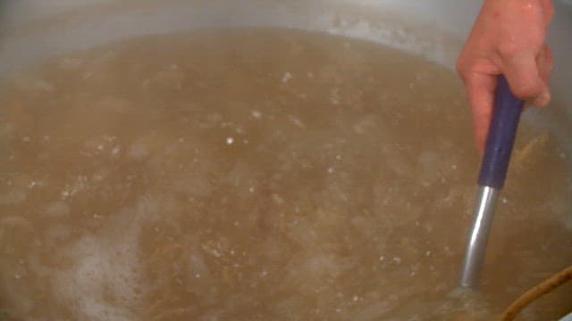 Ginseng being boiled in a large pot