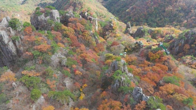 Colorful autumn mountain with rocky cliffs