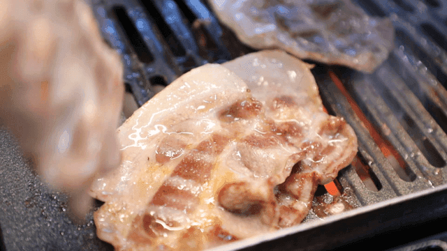 Thin pork belly grilled on hot grill