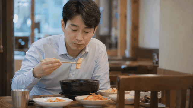 Man eating Korean food at restaurant